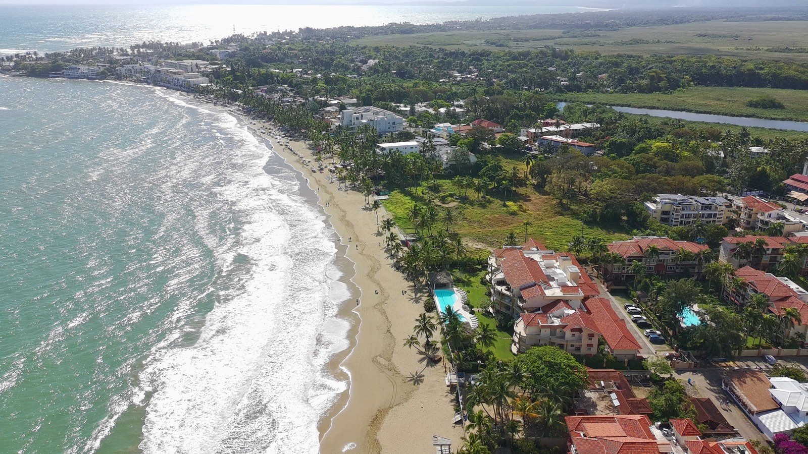 The long curve of Cabarete Bay seen from above